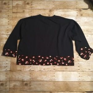 Black sweatshirt with floral trim